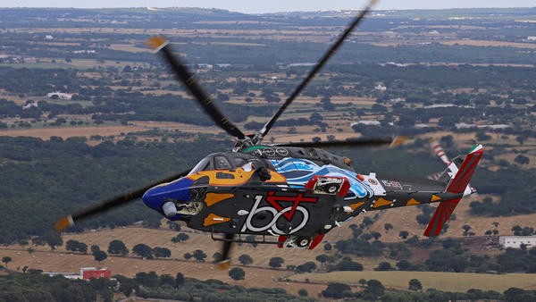 Helicopter flying over field