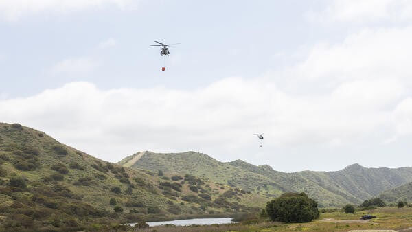 Helicopters carrying fire retardant