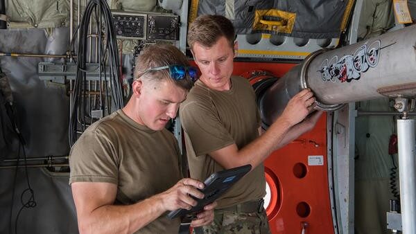 Plane workers using technology