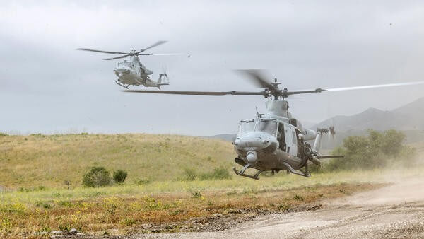 Two helicopters landing