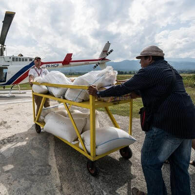 Helimission helicopter loaded with goods for relief efforts in Indonesia