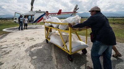 Helimission helicopter loaded with goods for relief efforts in Indonesia