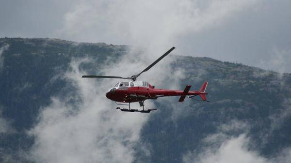 helicopter flying through clouds