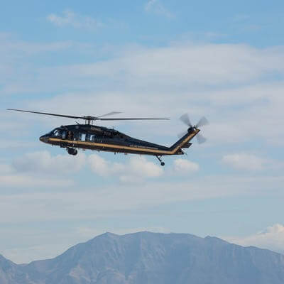 Helicopter above mountains