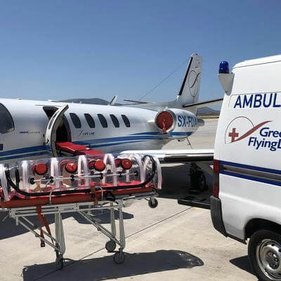 Plane and van with medical bed in-between