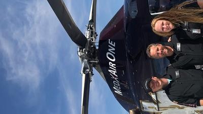 Photo of crew - left to right, Mike Sayler (pilot), Brent Tracy (paramedic), Becky Tissue (registered nurse).