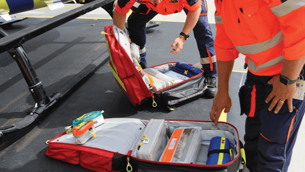 Paramedics sorting through equipment