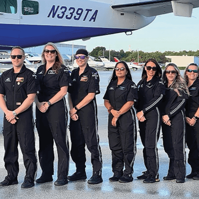 Crew standing in front of plane