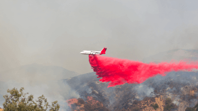 Plane dropping fire retardant