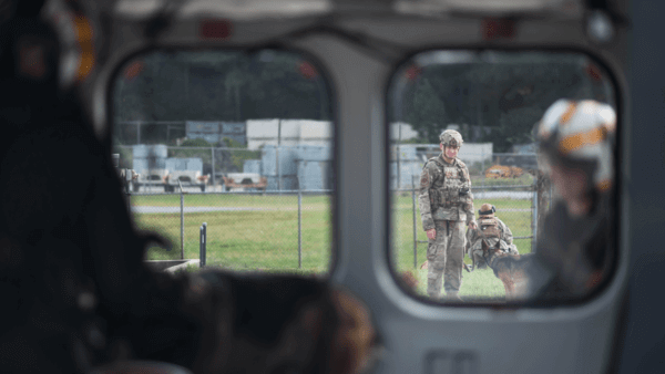 Military man and dog