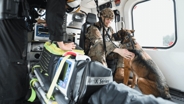 Military man with worker dog