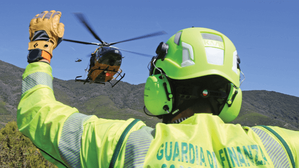 Paramedic waving down helicopter