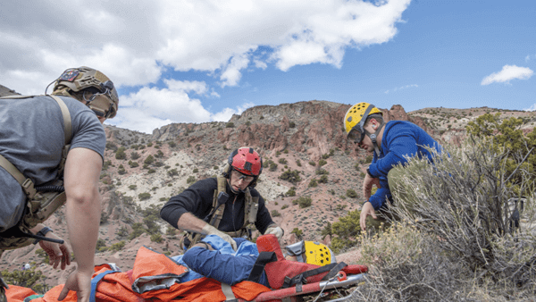 Med crew helping patient