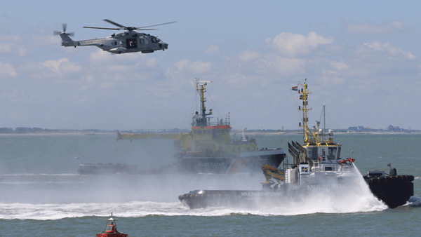 Helicopter flying above sea