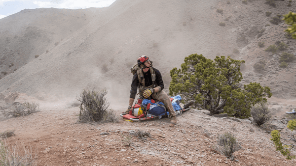 Paramedic helping patient