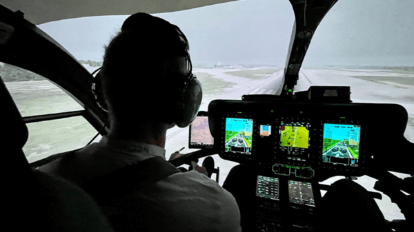 Pilot in cockpit of helicopter