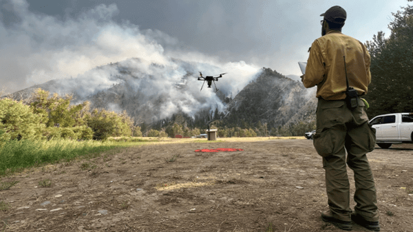 Man flying drone. Credit: USDA Forest Service